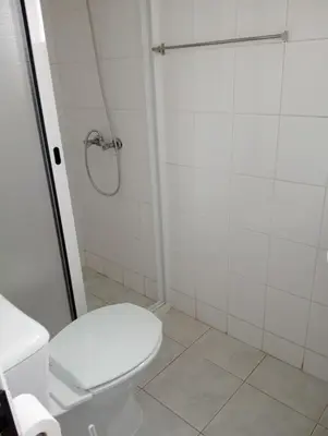 a bathroom with a toilet and a shower at Casa Ponte in Ponta do Sol