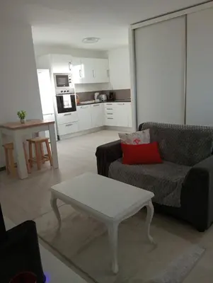 a living room with a couch and a coffee table at Casa Ponte in Ponta do Sol