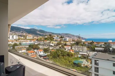 a view of a city from a balcony of a building at GuestReady - The perfect place to relax in Funchal in Funchal