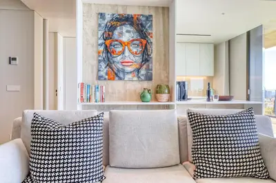 a living room with a couch with two pillows at Savoy Monumentalis, a Home in Madeira in Funchal