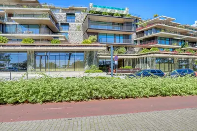 a building with cars parked in front of it at Savoy Monumentalis, a Home in Madeira in Funchal