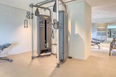 a gym with cardio equipment in a room at Savoy Monumentalis, a Home in Madeira in Funchal