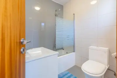 a bathroom with a toilet and a sink at FLH Funchal Sissi Lanço with View in Funchal