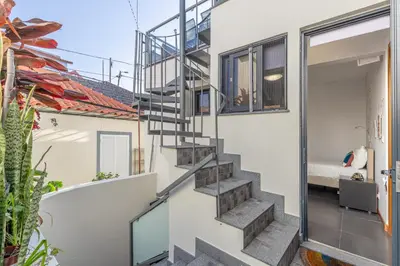 a staircase in a house with a bedroom at FLH Funchal Sissi Lanço with View in Funchal