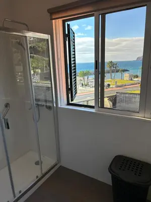 a bathroom with a shower and a window at 4 Saints apartement in Ribeira Brava