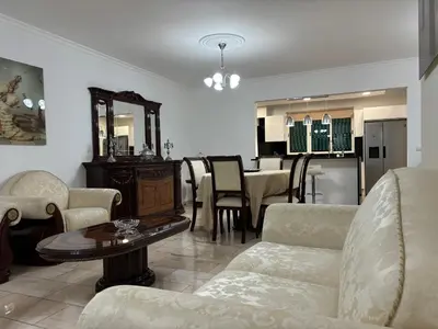a living room with couches and a table and a kitchen at 4 Saints apartement in Ribeira Brava