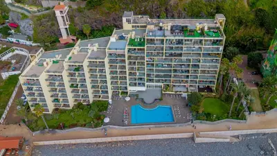 an aerial view of a beach with buildings and the ocean at Hip Heaven Apartment on Beach in Funchal