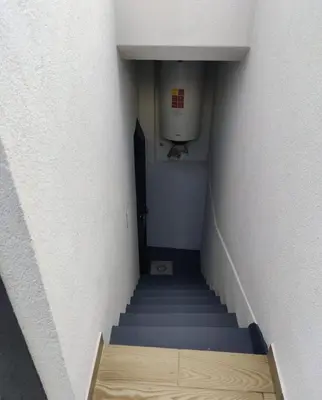 a staircase in a building with blue stairs and a urinal at Villa R Relíquia in Machico