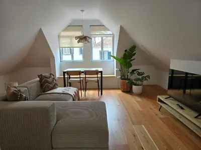 a living room with a couch and a table at Ficus Suites in Ponta do Sol