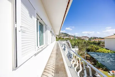 a balcony with a view of a building at Azur & Bellevue du Caniço by YOUR KEY in Caniço