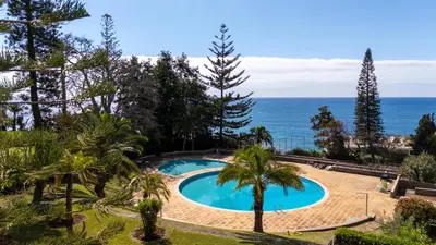 a swimming pool with the ocean in the background at Solar do Mar by LovelyStay in Funchal