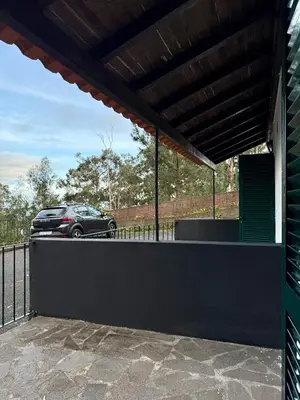 a car parked on top of a house at Habitación con estacionamiento y baño privado in Funchal
