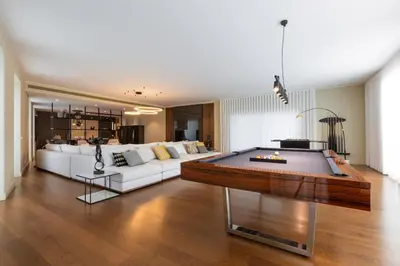 a pool table sitting in a living room with a pool table at Ocean View I Vincents Place I Madeira Palace I Funchal in Funchal