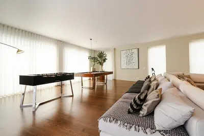 a dining room and living room with a table and chairs at Ocean View I Vincents Place I Madeira Palace I Funchal in Funchal