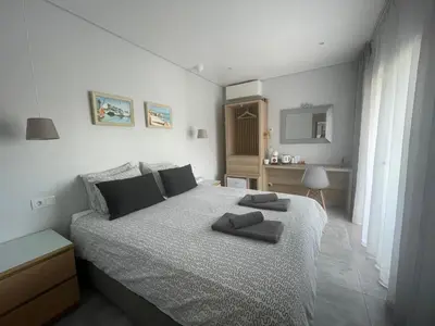 a bedroom with a bed with two towels on it at SalemaView Ensuite bedroom in Salema