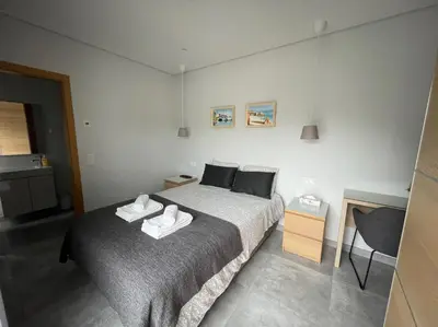 a bedroom with a bed with two towels on it at SalemaView Ensuite bedroom in Salema