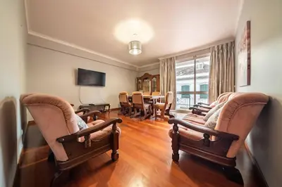 a living room with chairs and a dining room at Gorete Apartment by Mth in Funchal