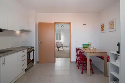 a kitchen with a table and a dining room at Casa Afonso by An Island Apart in Santana