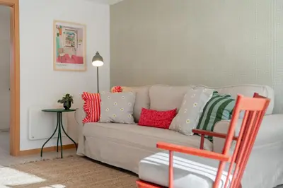 a living room with a couch with colorful pillows at Casa Afonso by An Island Apart in Santana