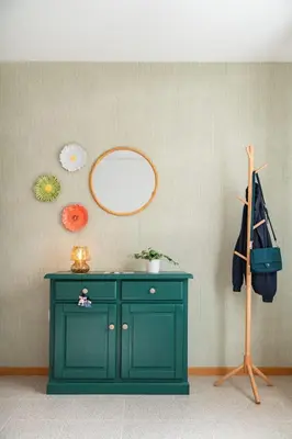 a green cabinet in a room with a mirror at Casa Afonso by An Island Apart in Santana