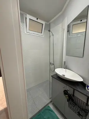 a bathroom with a glass shower and a sink at Cc39-Q2 in Funchal