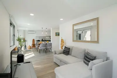 a balcony with two chairs and a view of the ocean at OurMadeira - TerraceSea Apartments in Ribeira Brava