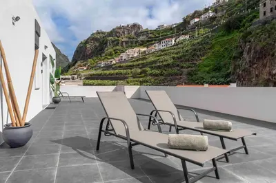 an apartment building with a view of the ocean at OurMadeira - TerraceSea Apartments in Ribeira Brava