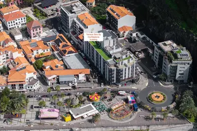 an aerial view of a town next to the ocean at OurMadeira - TerraceSea Apartments in Ribeira Brava