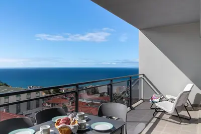 a balcony with a view of the ocean at Amparo II by An Island Apart in Funchal