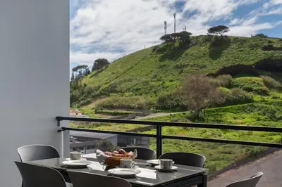 a table with a bowl of food on top of a hill at Amparo II by An Island Apart in Funchal