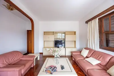a living room with a couch and a table at Silva Retreat Villa in São Jorge