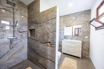 a bathroom with a shower and a sink at Silva Retreat Villa in São Jorge