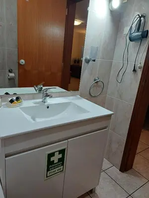 a bathroom with a sink and a shower at Apartamento Amalita em Burgau in Burgau