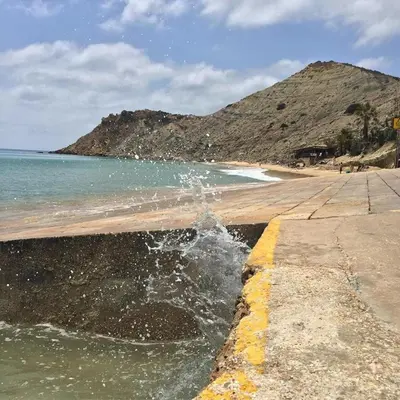 a body of water next to a beach at Apartamento Amalita em Burgau in Burgau
