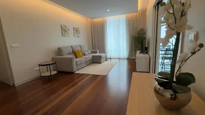 a living room with a couch and a table at LA VIE Center Flat in Funchal