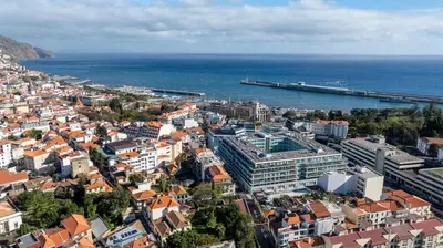 an aerial view of a city next to the ocean at LA VIE Center Flat in Funchal