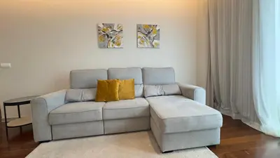 a living room with a couch and a chair at LA VIE Center Flat in Funchal