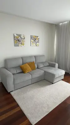 a living room with a gray couch with yellow pillows at LA VIE Center Flat in Funchal