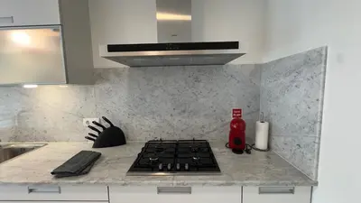 a kitchen with a stove top oven in a kitchen at LA VIE Center Flat in Funchal
