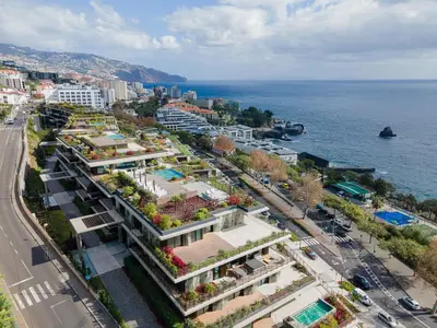 an aerial view of a city and the ocean at Savoy Residence Monumentalis N&N by LM&AC Signature in Funchal