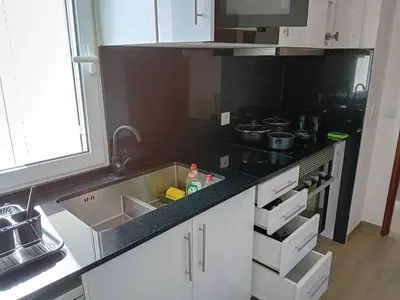 a kitchen with a sink and a stove at apartamento Zarco in Machico