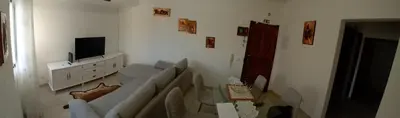 a living room with a couch and a tv at apartamento Zarco in Machico