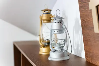 a gold and silver lantern sitting on a table at A lovely home in a quiet area in Quinta Grande