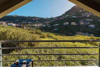 a view from the balcony of a house on a hill at A lovely home in a quiet area in Quinta Grande