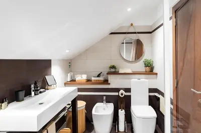 a bathroom with a sink and a toilet at A lovely home in a quiet area in Quinta Grande