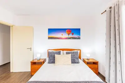a bedroom with a large bed with two night stands at Recanto do Caminheiro by YOUR KEY in Santana