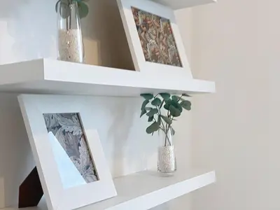 a white shelf with a mirror and a plant at Acanto Loft by Atlantic Holiday in Funchal