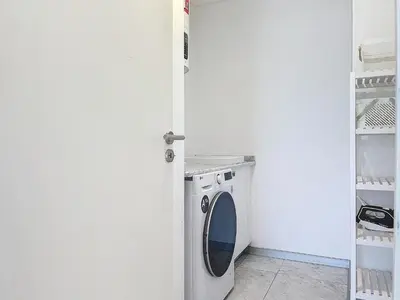 a white laundry room with a washing machine in it at Acanto Loft by Atlantic Holiday in Funchal