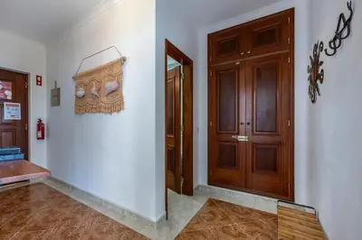 a hallway with a door to a room with a floor at Luz Heaven - Top floor Seaview Apartment in Luz