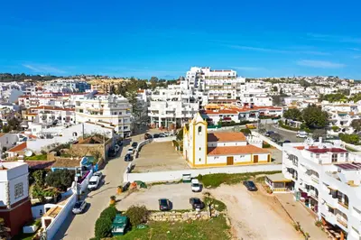 an aerial view of a city with white buildings at Luz Heaven - Top floor Seaview Apartment in Luz